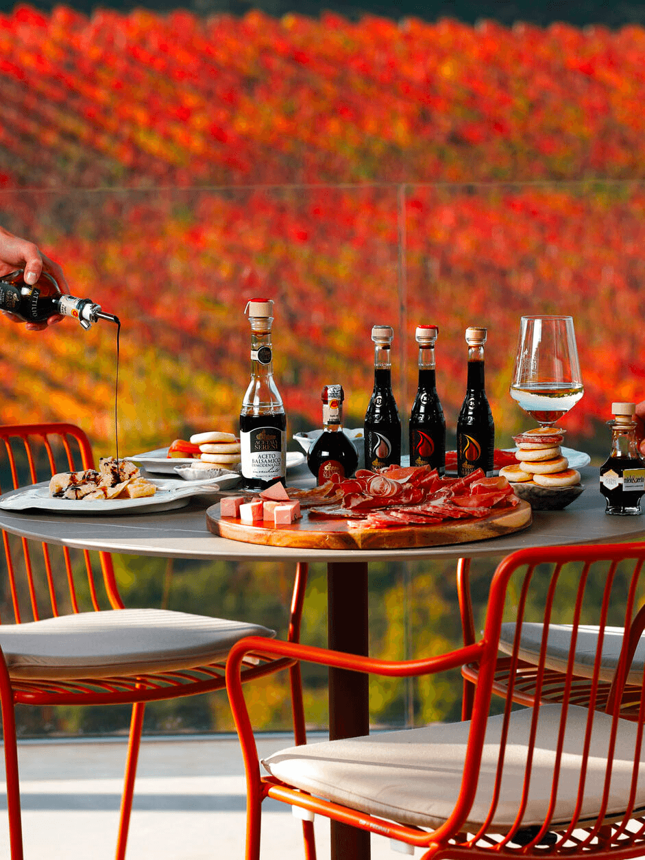 Outdoor vineyard tasting table with charcuterie and balsamic