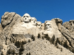 Granite presidential memorial sculpture set in Black Hills vista