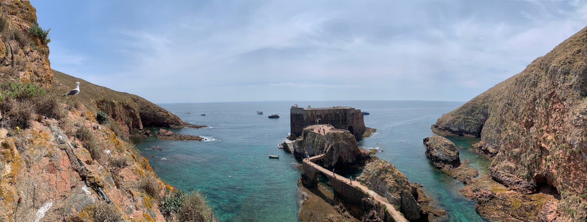Rocky coastal cove with turquoise water and rugged sea cliffs Portugal
