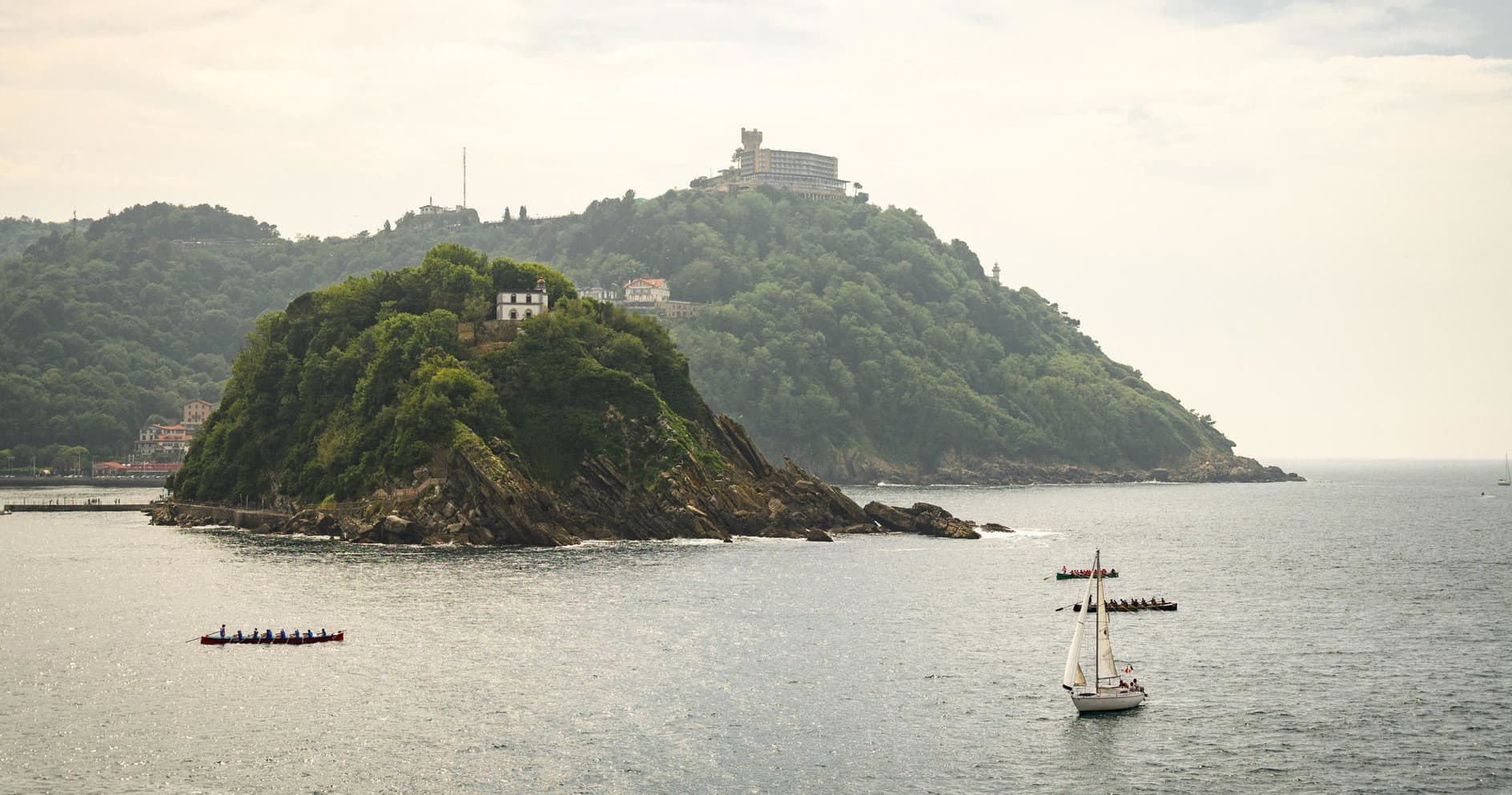 Small island skyline by coastal waters near San Sebastián