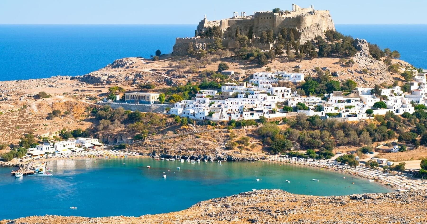 Aerial coastal village and fortress on Rhodes island bay