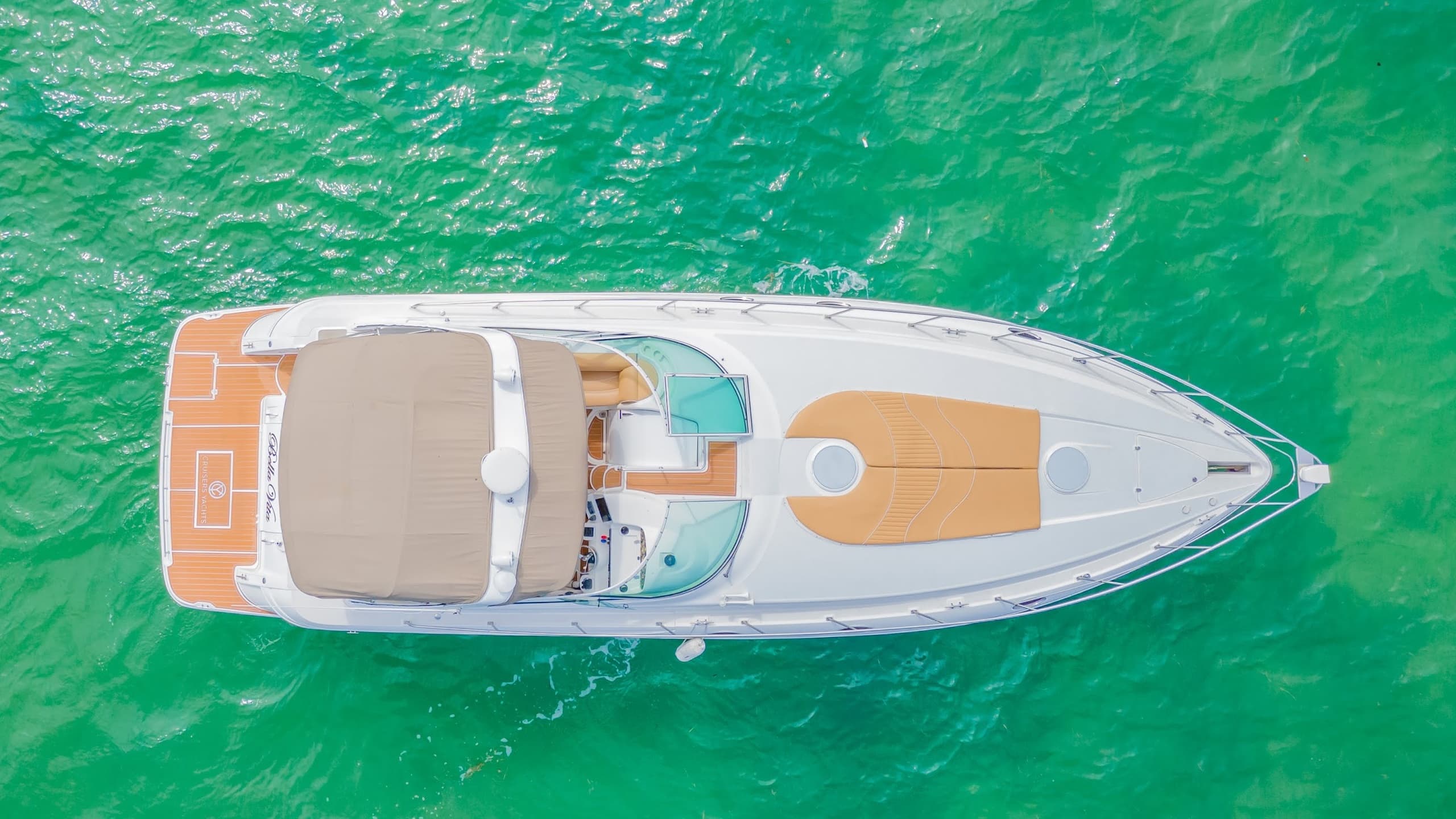 Top-down yacht aerial over turquoise water showing deck layout
