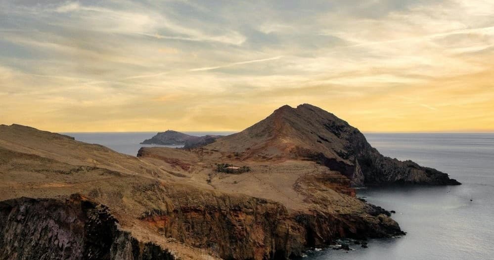 Rocky peninsula at sunset with panoramic ocean views in Madeira