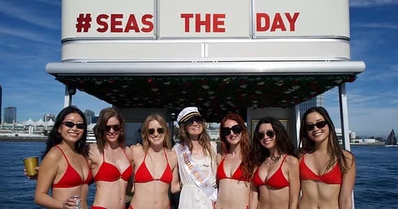 Bachelorette group posing on San Diego charter boat deck