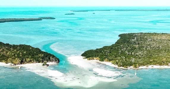 Aerial view of turquoise island lagoon and sandy channel