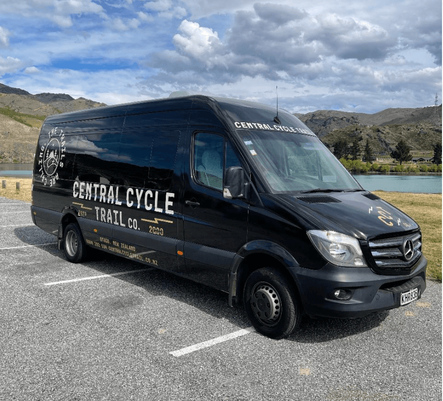 Central Cycle Trail black van parked by lake under clouds