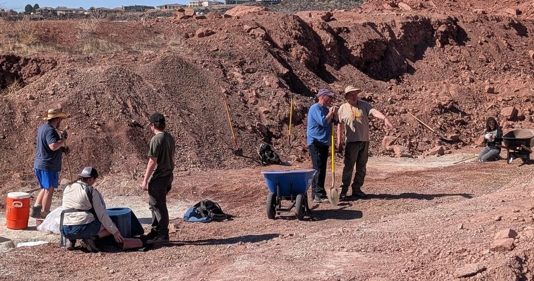 Paleontologists excavating dinosaur fossils in Utah badlands