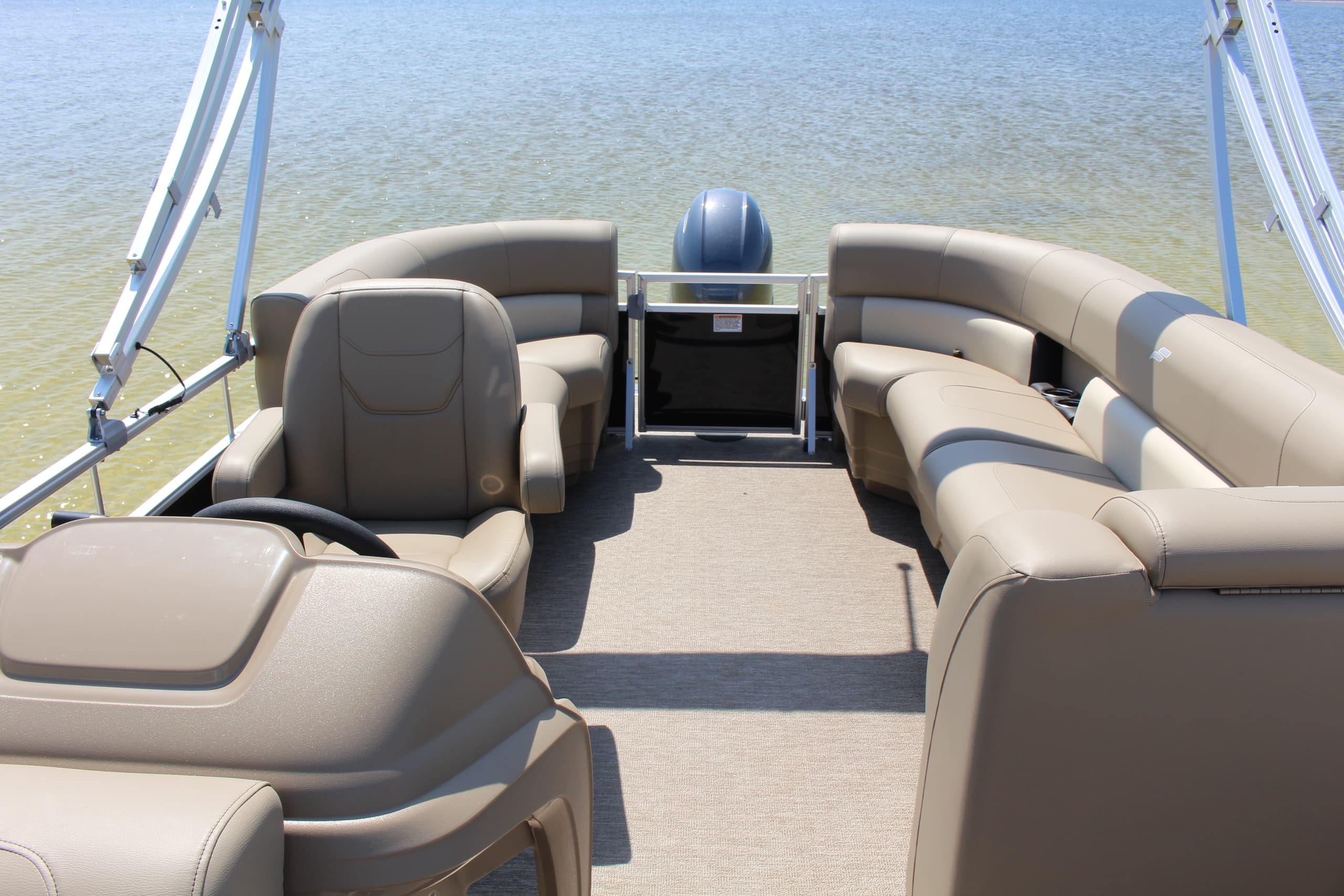 Front deck pontoon seating overlooking calm Gulf waters