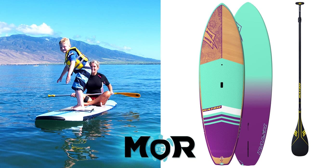 Stand up paddleboarder cruising calm bay with paddle
