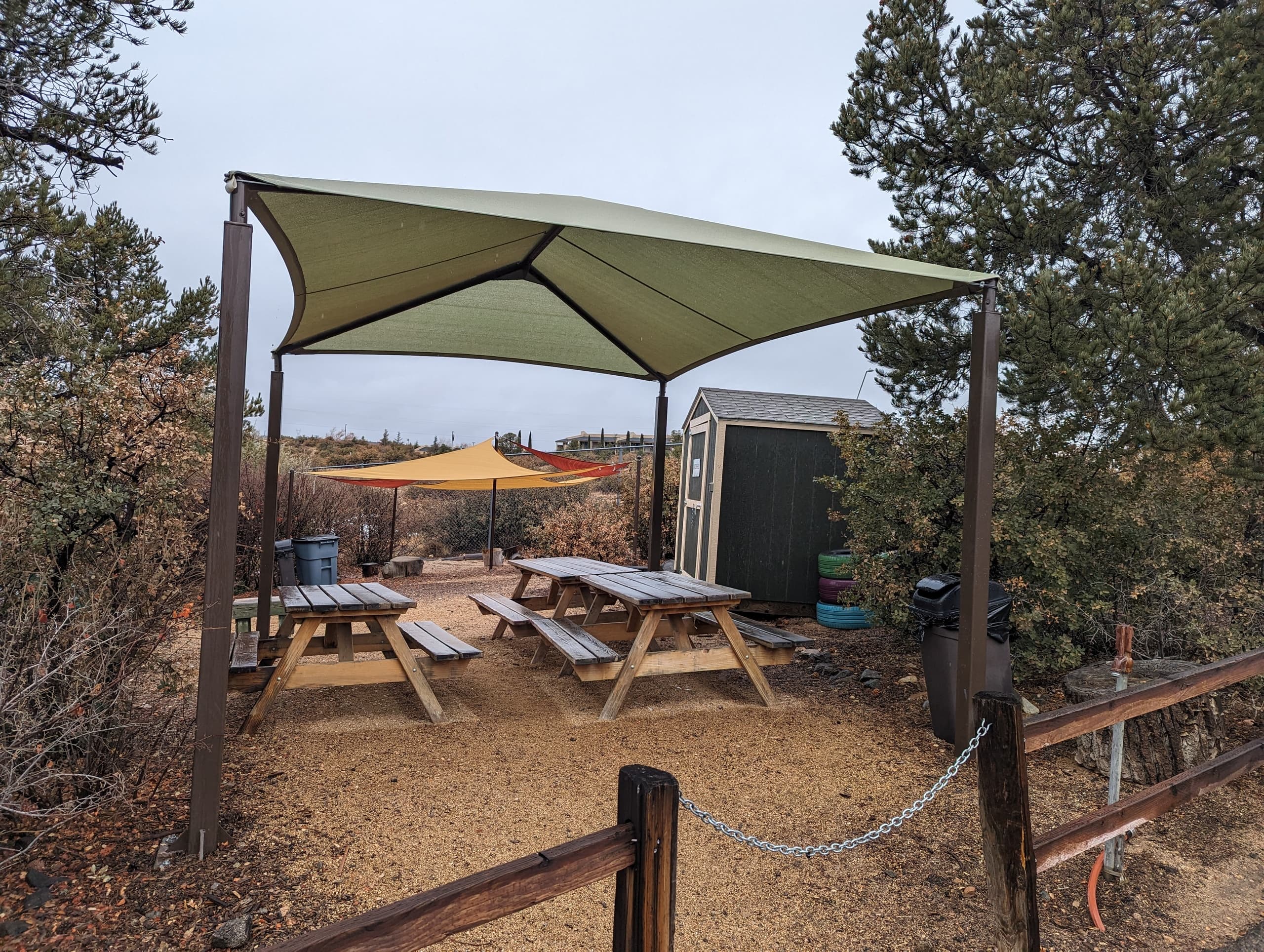 Outdoor shade structure and seating at Heritage Park Zoo