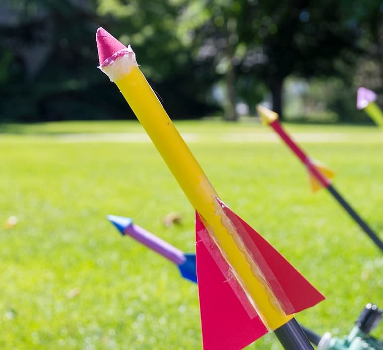 Model rockets staged on grass ready for backyard launch