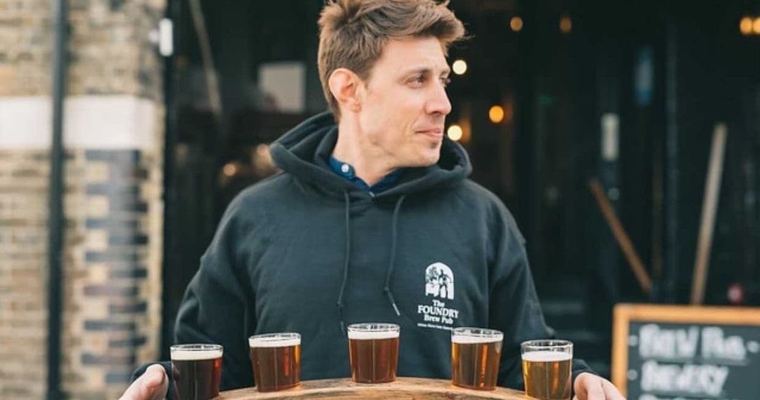 Outdoor beer tasting flight served at market stall in Canterbury