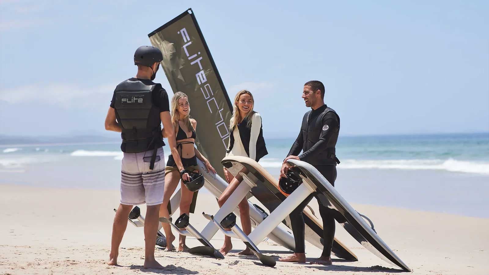 Beach e-foil lesson with instructors and students on Mallorca shore