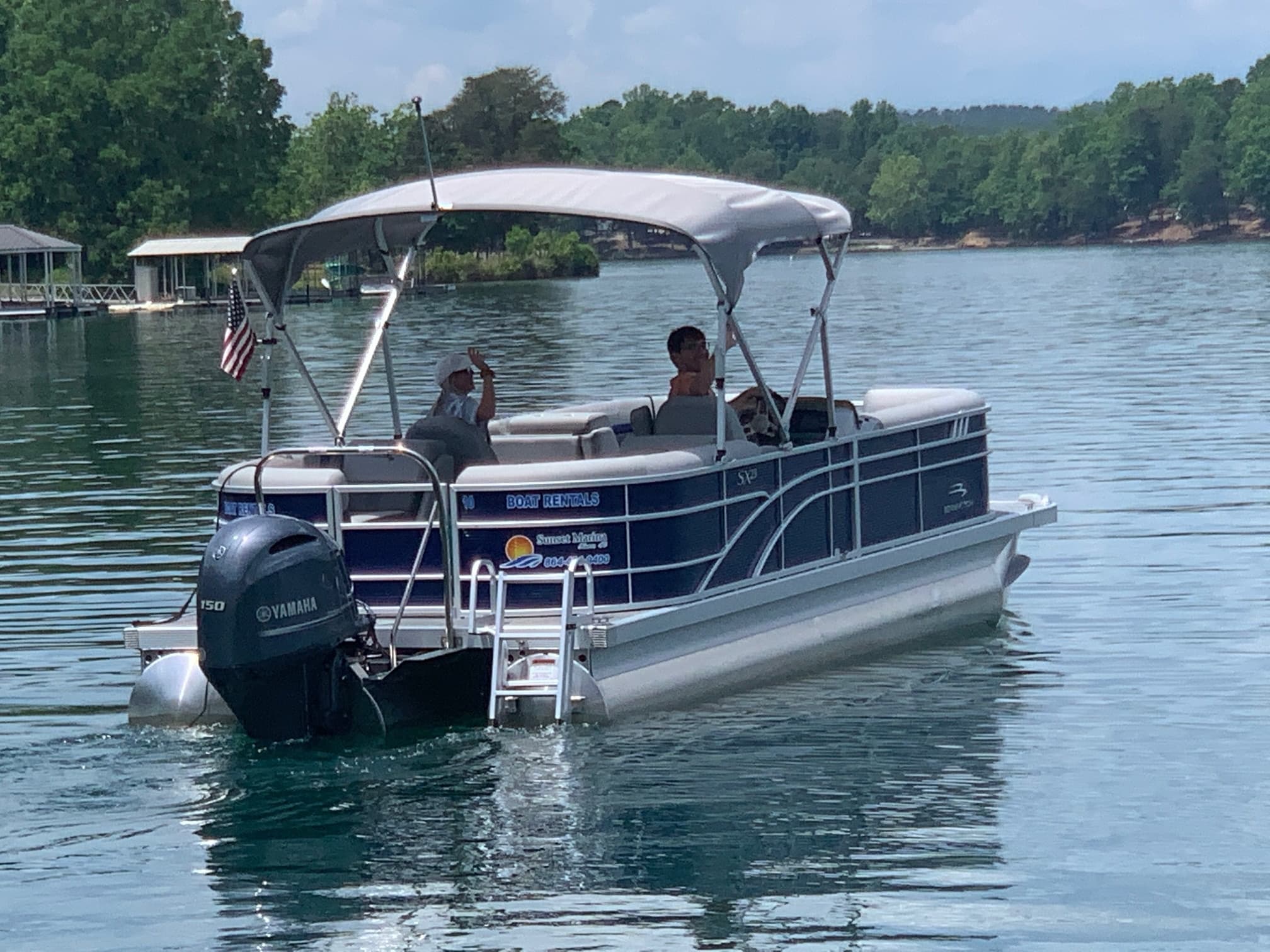 Close view of pontoon boat and passengers on Lake Keowee