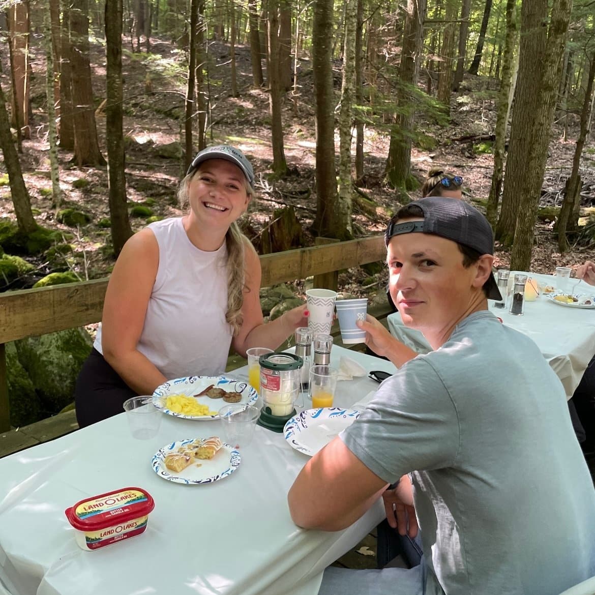 Forest picnic and outdoor dining at shaded woodland campsite
