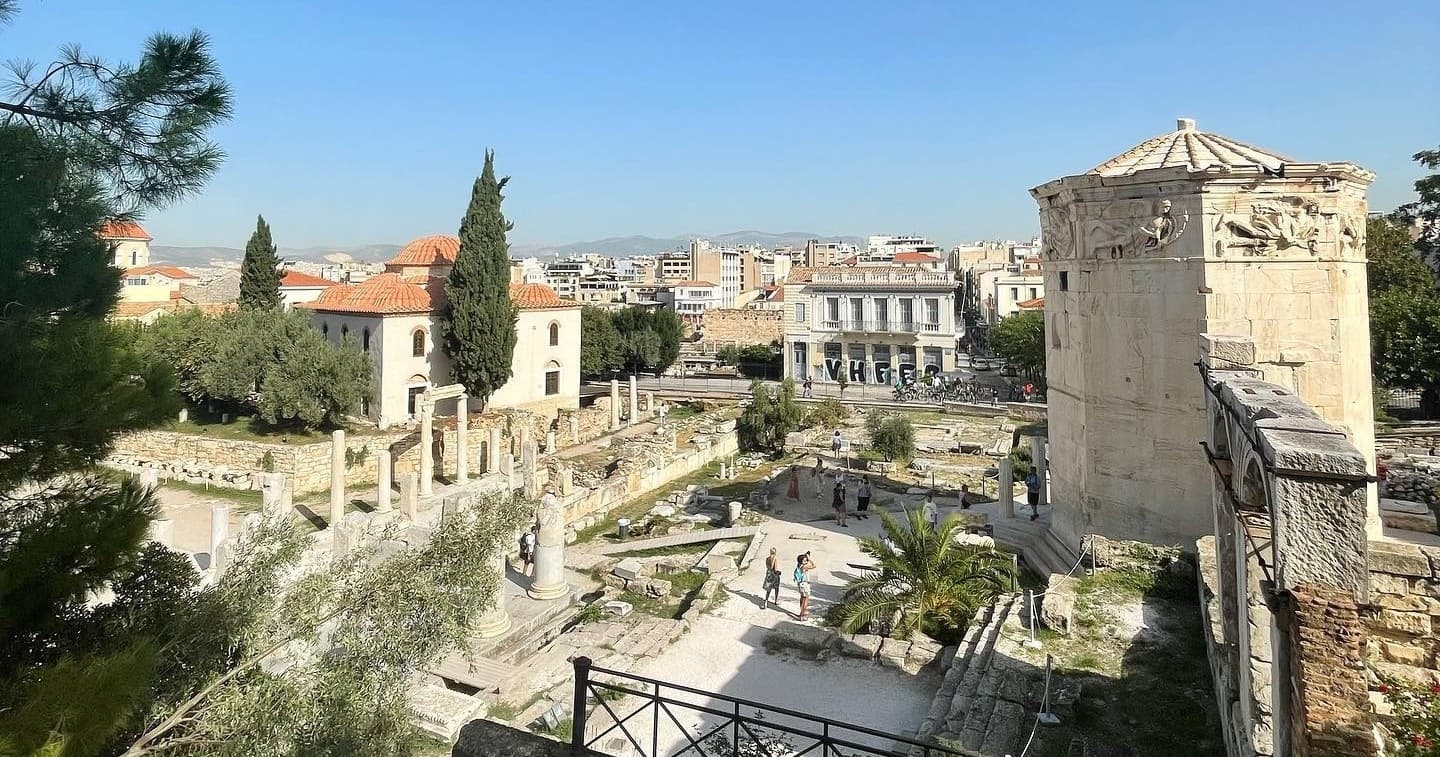 Ancient Acropolis ruins and city view over Athens hilltop