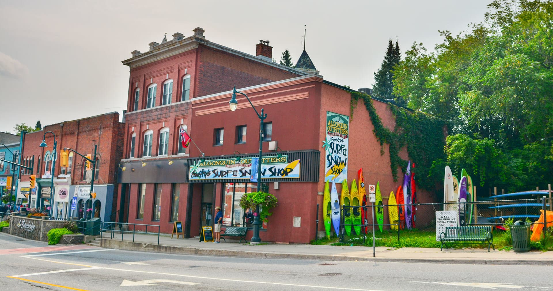 Algonquin Outfitters storefront with paddles and kayaks displayed