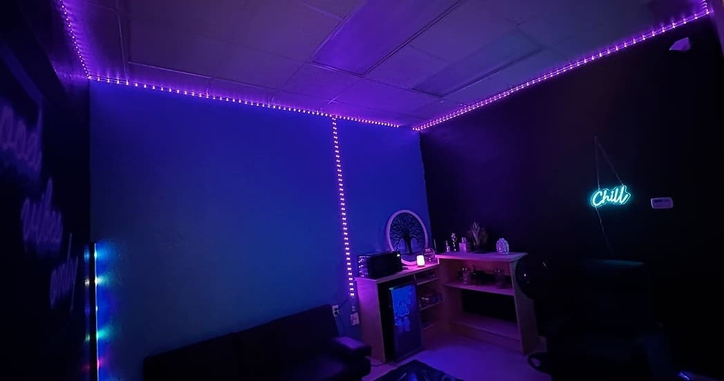Neon-lit chill room interior used for parties at indoor smash venue