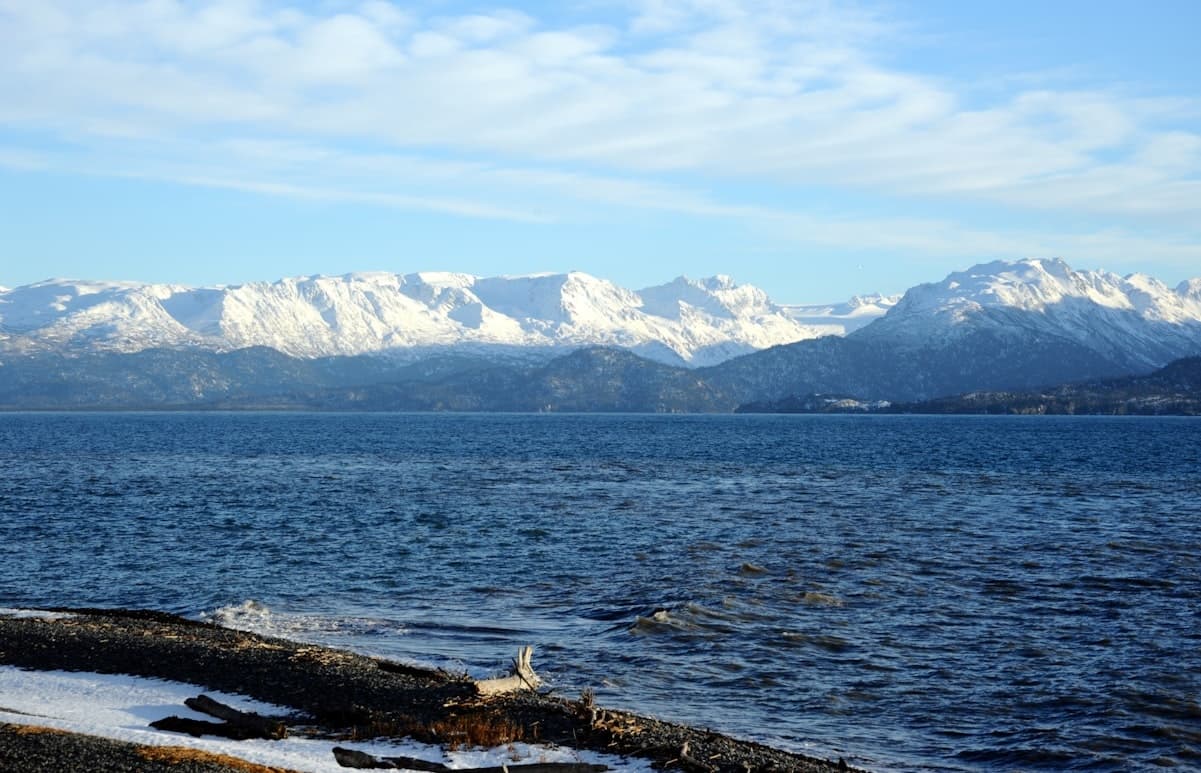 Snow-capped mountains across coastal waters near Homer, Alaska
