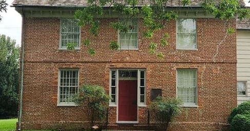 Historic brick colonial house exterior at Dorchester, outdoor tour