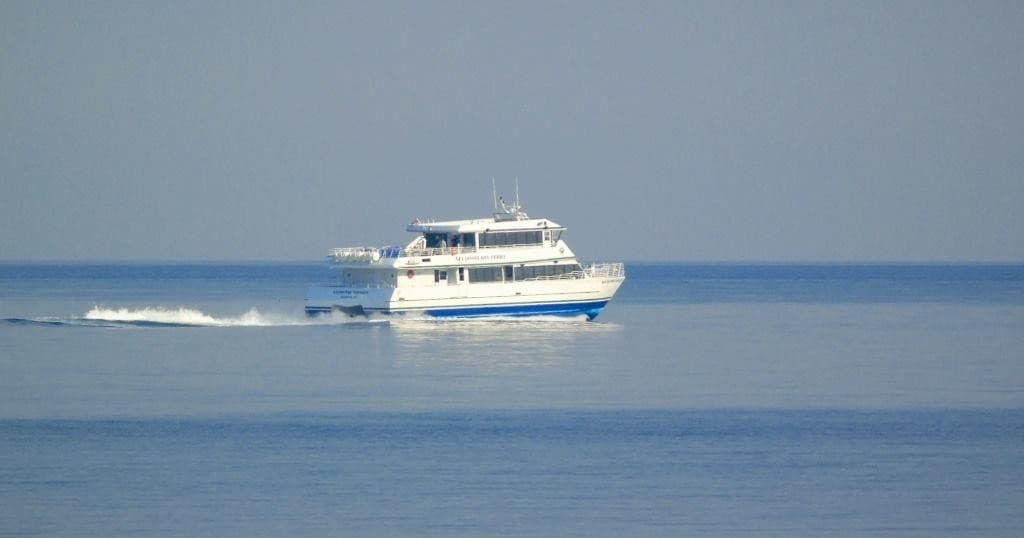 Coastal ferry speedboat cruising waters off Seldovia, Alaska