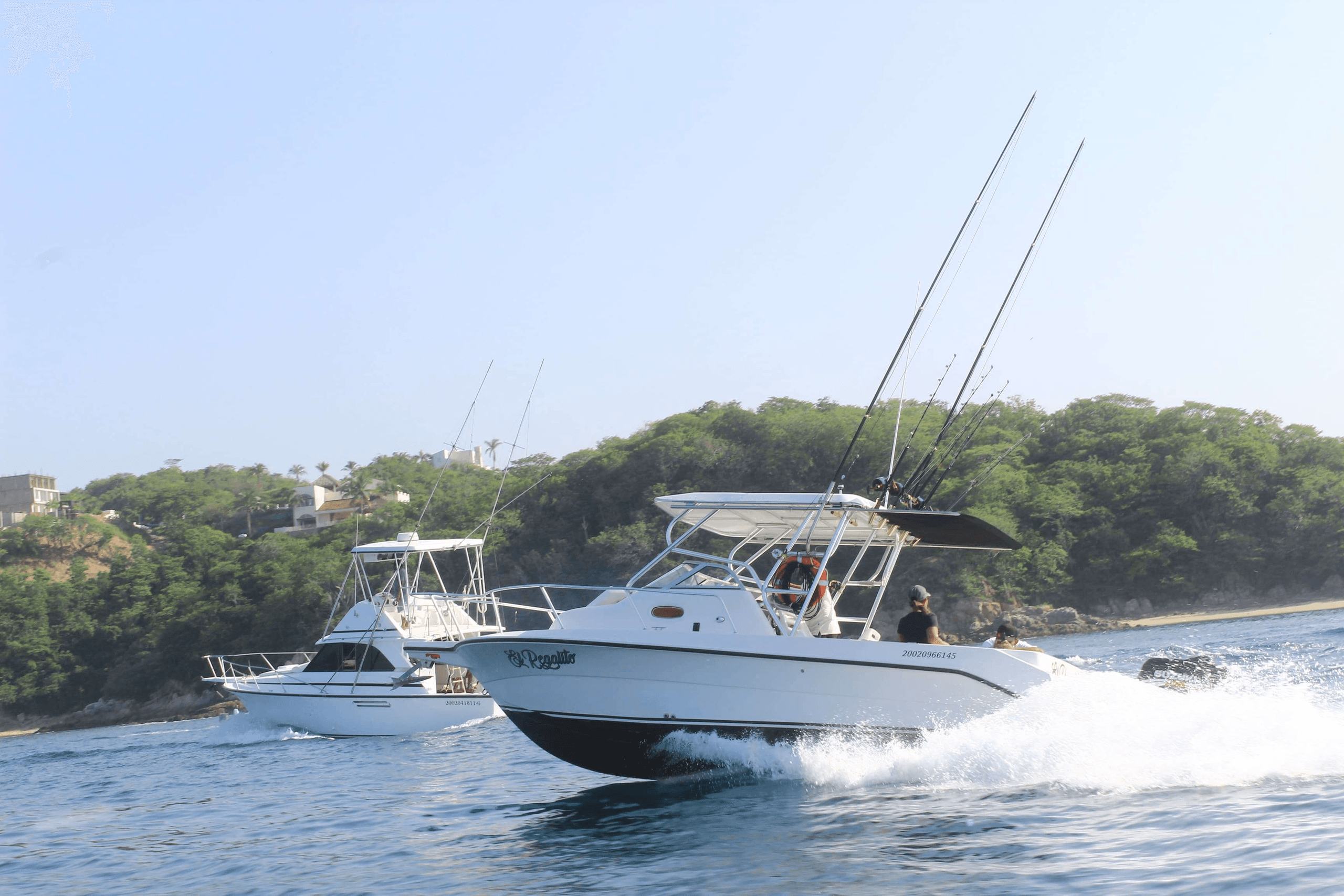 Sport fishing boats speeding on open ocean near Huatulco coast