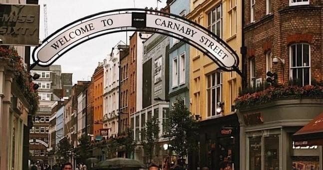 Pedestrian street arch and shops on Carnaby Street, London