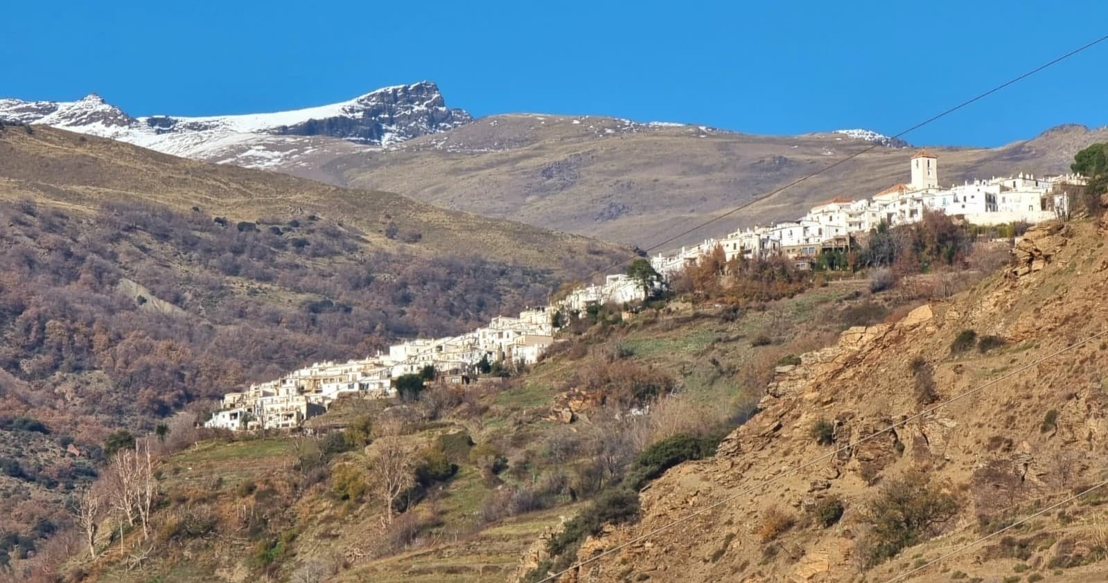 Mountain village panorama along Andalusian hillside and trails