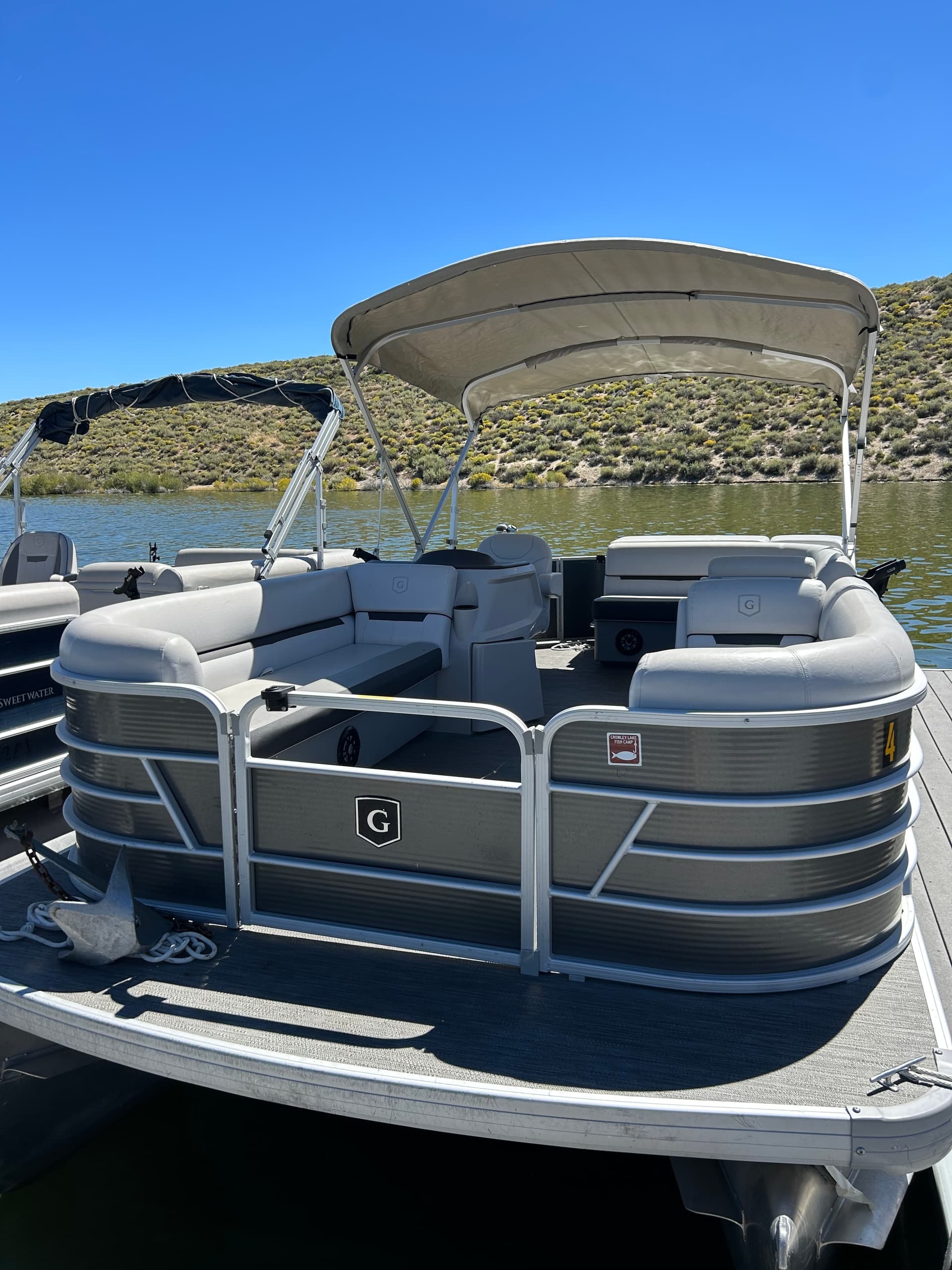 Rear deck of pontoon boat at Crowley Lake, shaded seating