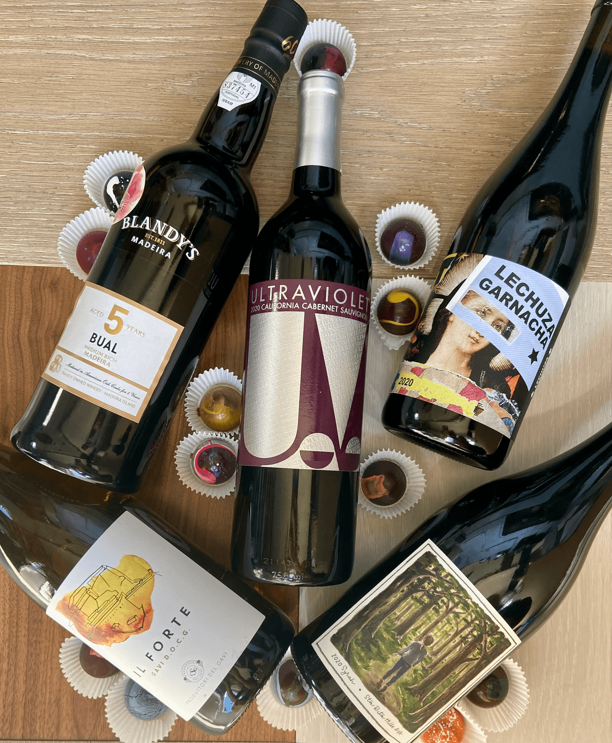 Assorted wine bottles and chocolates arranged for indoor tasting