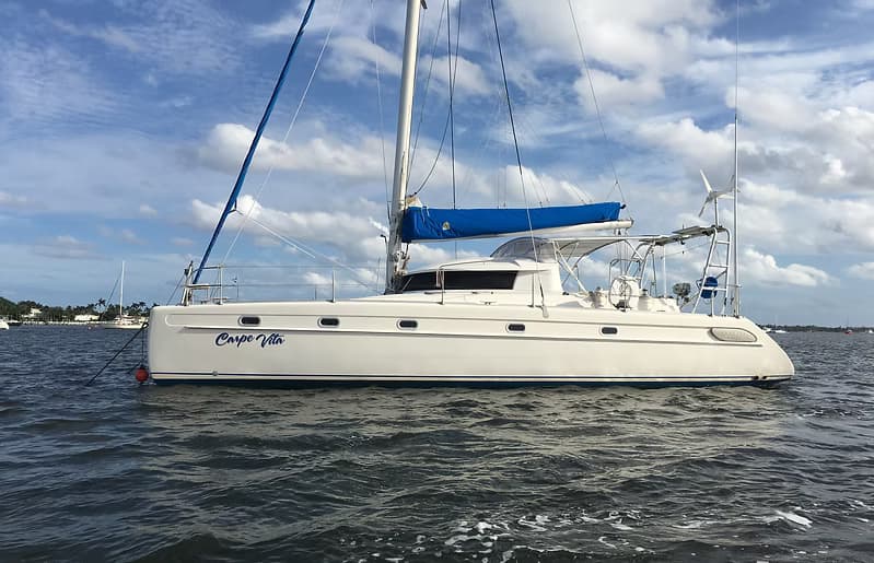 Catamaran sailing on calm coastal waters nearshore
