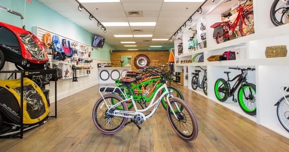 Bicycle shop showroom with electric bikes on display, indoor retail