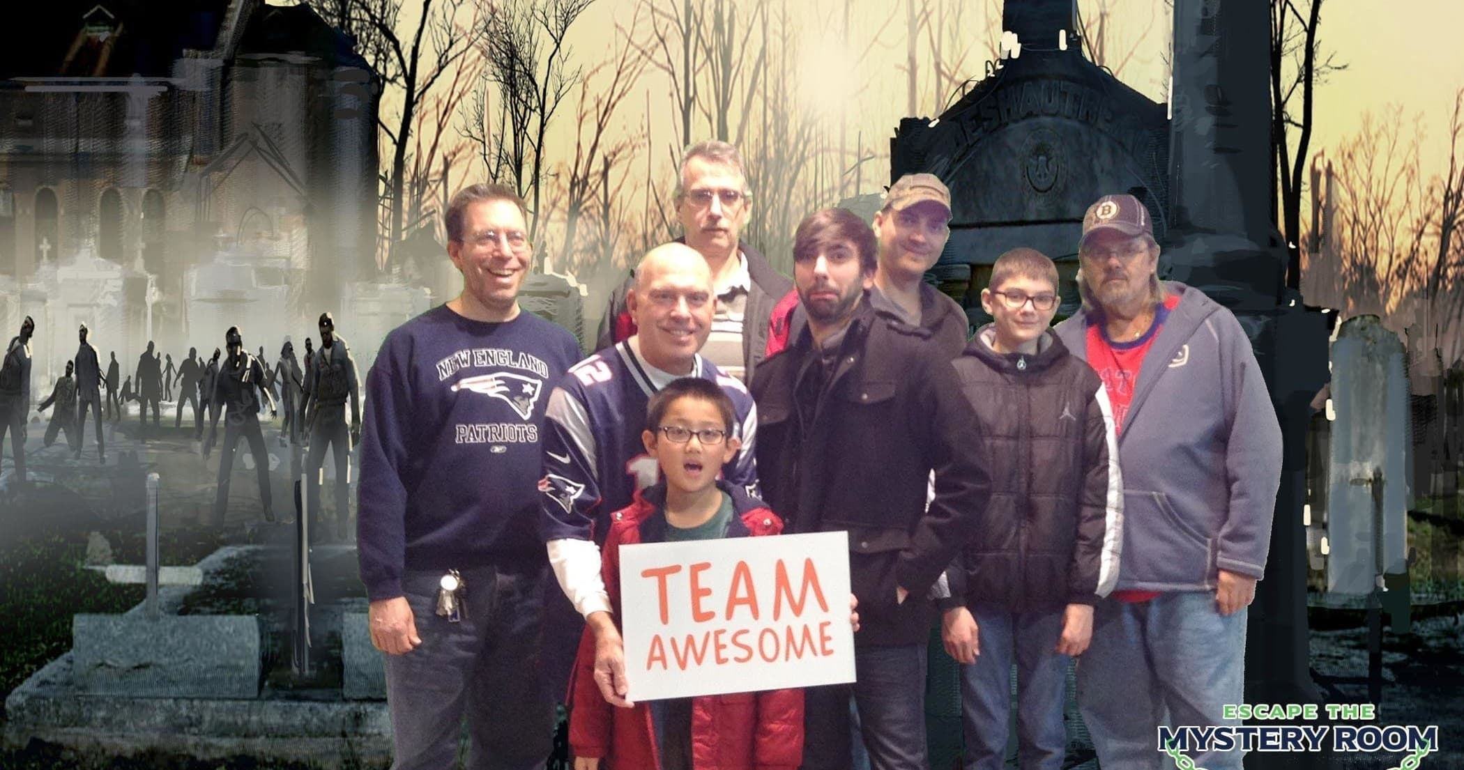 Team posing in foggy cemetery for outdoor zombie-hunt experience