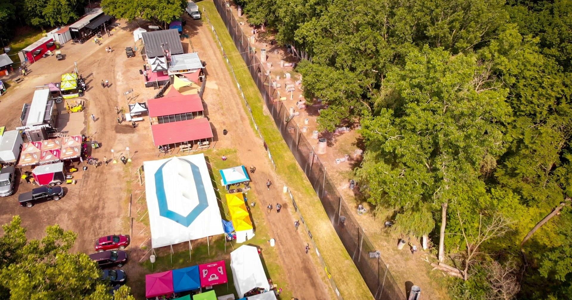 Aerial view of Hell Survivors paintball field with tents