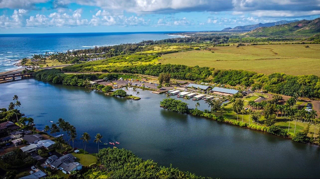 Coastal lagoon and marina with kayaks and shoreline vistas