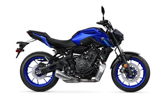 Blue street motorcycle on white backdrop, sporty naked bike profile