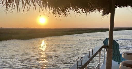 Sunset Boat Tour with Slack Tide Tiki in Coastal Area