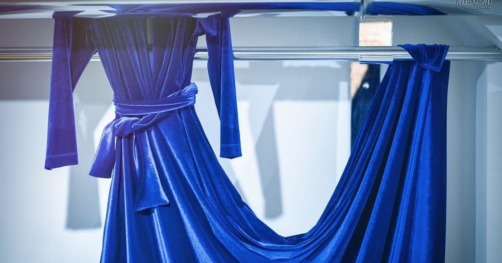 Vibrant blue fabric draped in Milan atelier showcasing textiles