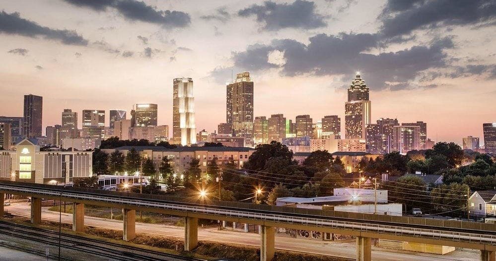 Panoramic city skyline at dusk over river for urban exploration