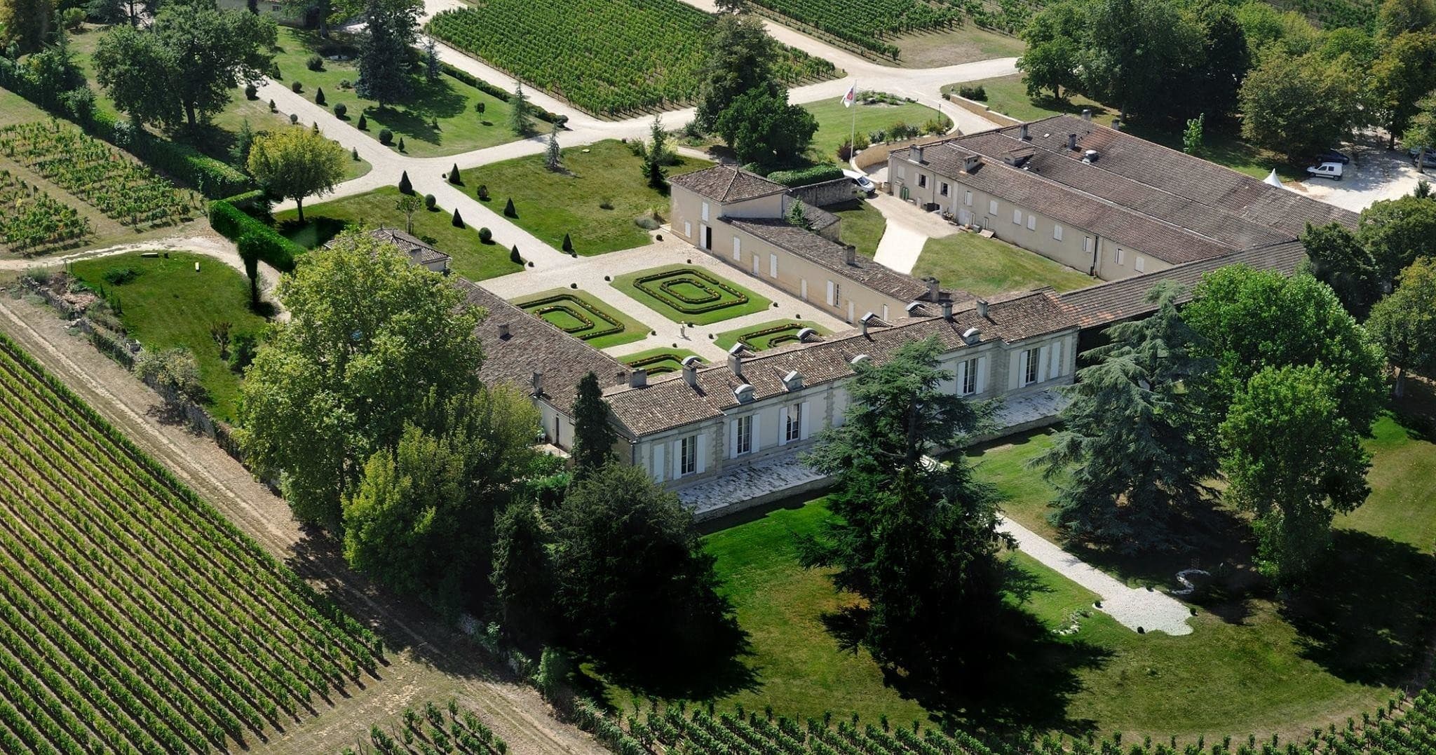 Aerial view of Château and surrounding vineyards in Bordeaux