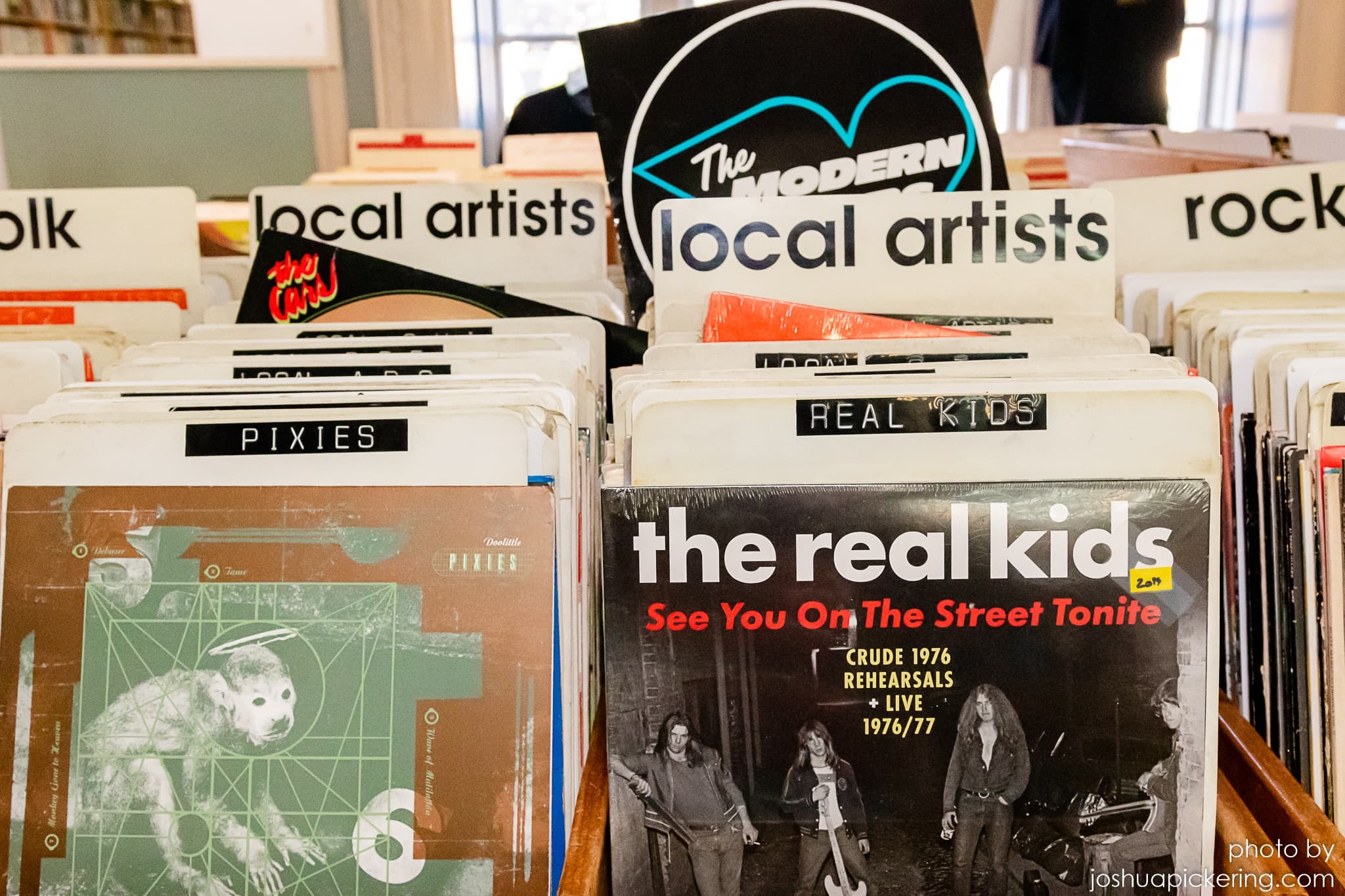 Vinyl records and album covers in local record shop interior