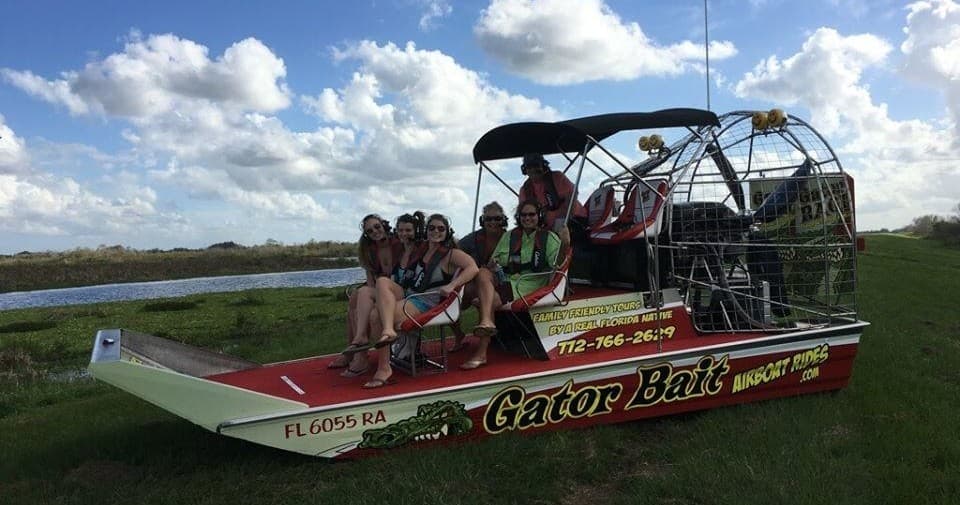 Gator Bait airboat tour group on marshland in Florida