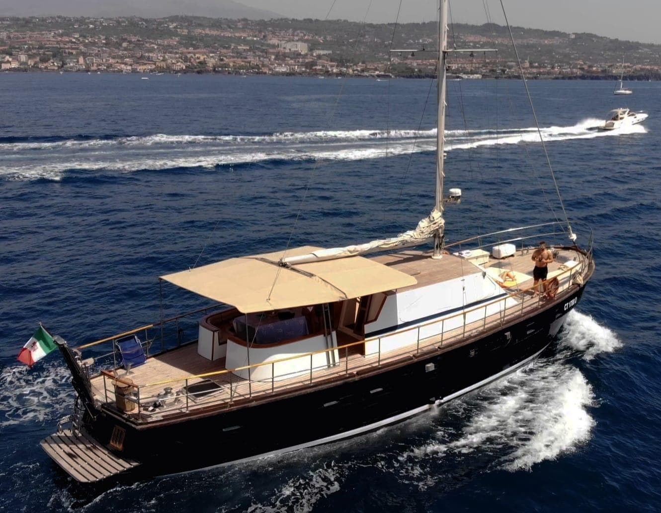 Classic wooden gulet sailing along coastal Mediterranean waters