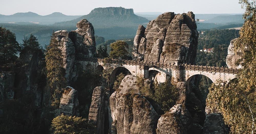 Hikers on scenic Bastei rock bridge in Saxon Switzerland