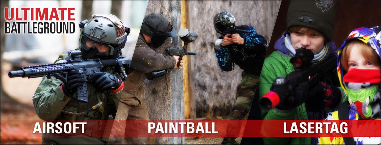 Action airsoft and paintball players in outdoor battleground field