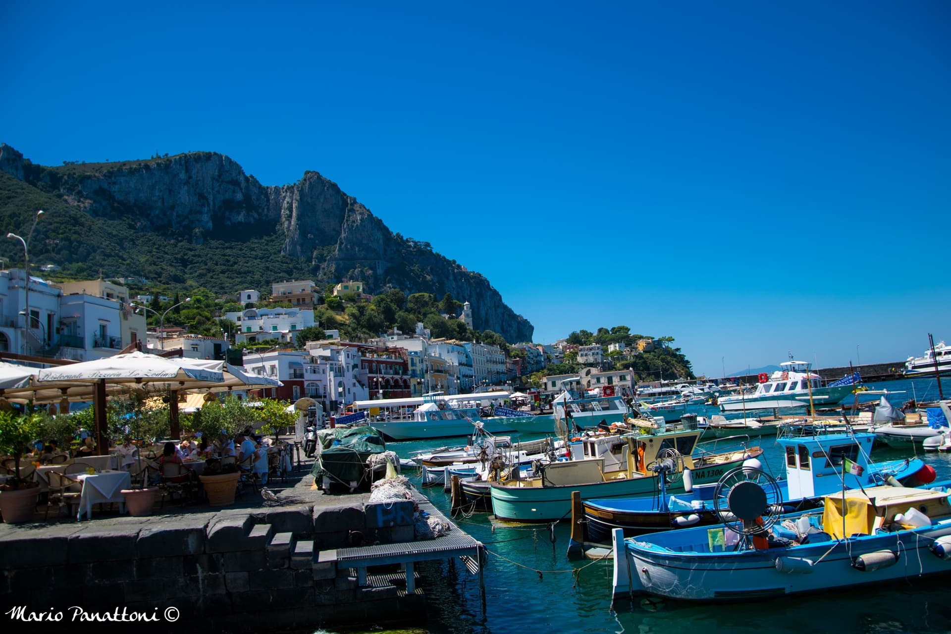 Sunny marina on the Amalfi Coast with colorful fishing boats