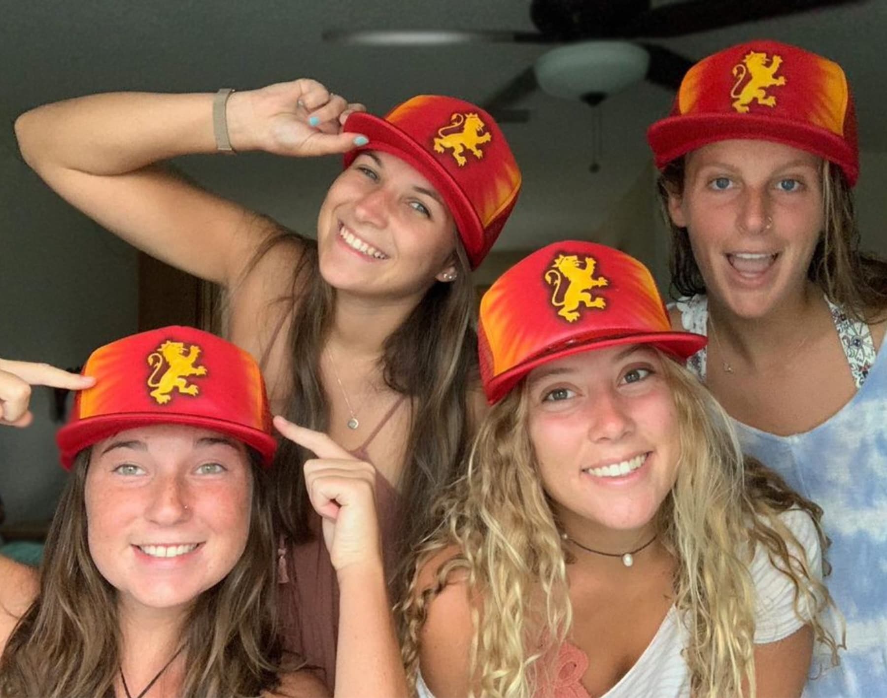 Friends wearing surf-style hats indoors posing for summer surf vibe
