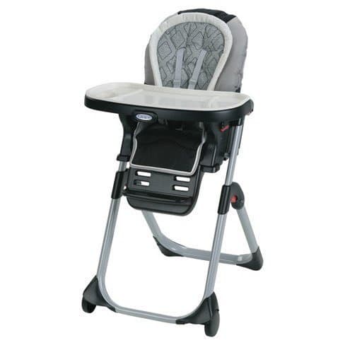 Adjustable high chair at kitchen table for toddler feeding