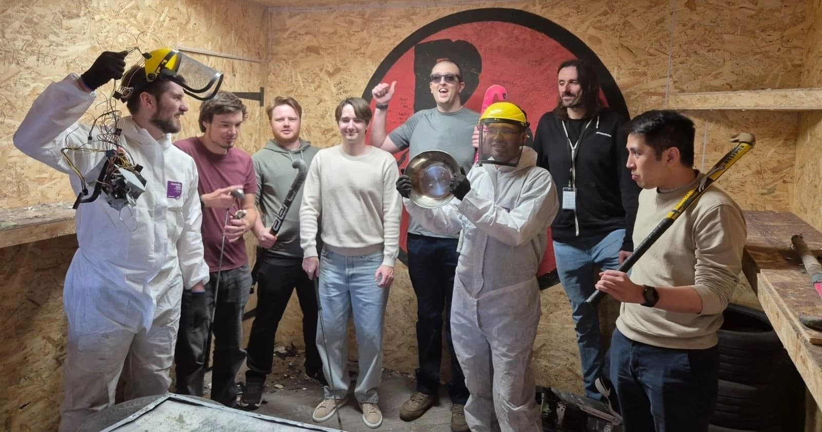 Friends in indoor rage room smashing items in Leamington Spa
