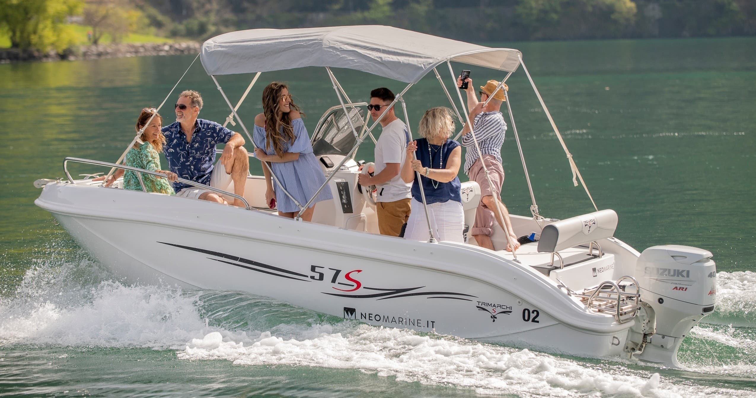 Motorboat cruising on scenic alpine lake with passengers enjoying ride